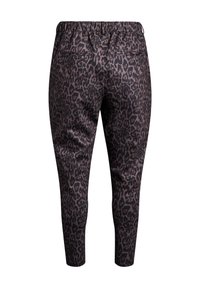 Pantalons en imprimé léopard en marron foncé et noir. Taille élastique et deux poches arrière. Coupe ajustée avec une texture lisse.