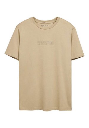 T-shirt beige à manches courtes avec col rond, logo "TEDDY SMITH" en relief centré sur la poitrine, coupe régulière.