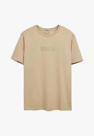 T-shirt beige à manches courtes avec col rond, logo "TEDDY SMITH" en relief centré sur la poitrine, coupe régulière.