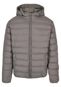 Grå vadderad puffjacka med huva, fullständig frontdragkedja, två framfickor och justerbara dragsko på huvan.