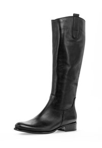 Černá kožená vysoká botka s kulatou špičkou, nízkým blokovým podpatkem a poutkem nahoře. Hladký povrch s minimem švů.