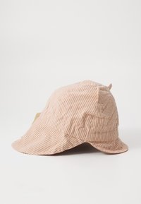 Striped bucket hat in light orange and white. Soft fabric with a rounded crown and a wide, floppy brim. Features a stitching detail.