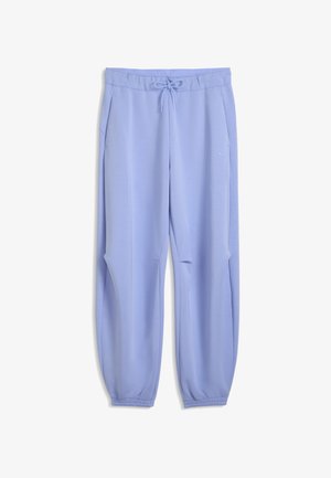 Ljusblå, lediga sweatpants med elastisk midja och justerbar dragsko. Har sidfickor och ribbade muddar vid anklarna.