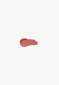 Tache de rouge à lèvres mauve-rose sur fond blanc, montrant la texture et la consistance crémeuse.
