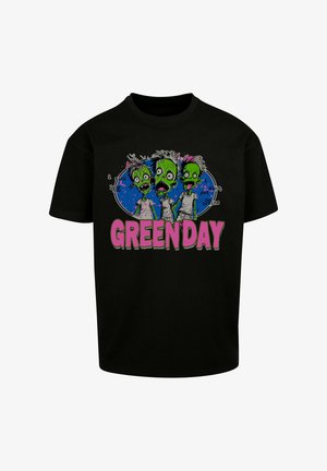 Fekete pamut póló színes zombi grafikákkal, zöld bőrrel és színes hajjal; a design alatt vastag rózsaszín betűkkel "GREEN DAY" felirat.