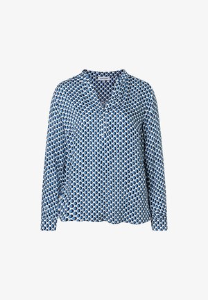 Leichte blaue Bluse mit langen Ärmeln und V-Ausschnitt, die ein sich wiederholendes ovales Muster in verschiedenen Blautönen aufweist. Weiche Stofftextur.