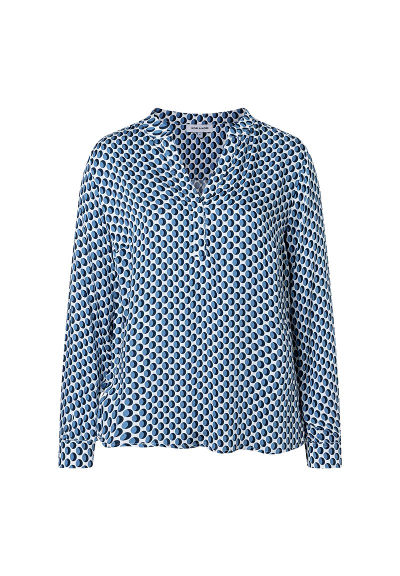 Leichte blaue Bluse mit langen Ärmeln und V-Ausschnitt, die ein sich wiederholendes ovales Muster in verschiedenen Blautönen aufweist. Weiche Stofftextur.
