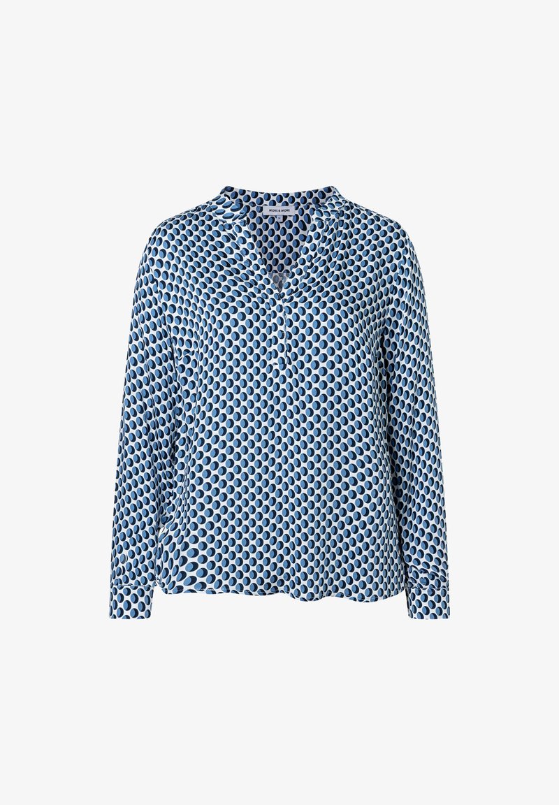 Leichte blaue Bluse mit langen Ärmeln und V-Ausschnitt, die ein sich wiederholendes ovales Muster in verschiedenen Blautönen aufweist. Weiche Stofftextur.