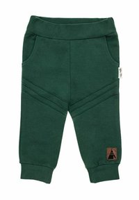 Ciemnozielone bawełniane spodnie dresowe z prążkowanym paskiem w talii, bocznymi kieszeniami i skośnymi przeszyciami. Posiadają brązową metkę z wzorem namiotu.