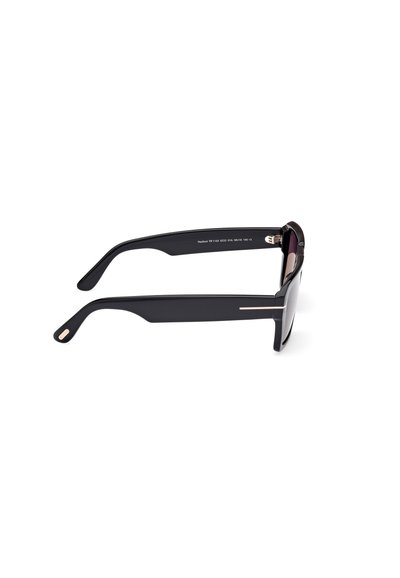Black sunglasses with a sleek design, featuring a wide frame, straight temples, and gold accents on the sides. Lenses are dark purple.