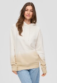 Kaptur z bluzą w kremowym kolorze z efektem ombre przechodzącym w beż, z przednią kieszenią i ściśniętymi mankietami. Miękka faktura materiału.