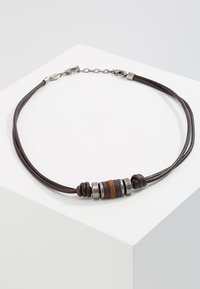 Brown leather necklace featuring metal and textured beads in various colors, with a lobster clasp closure and chain extension.