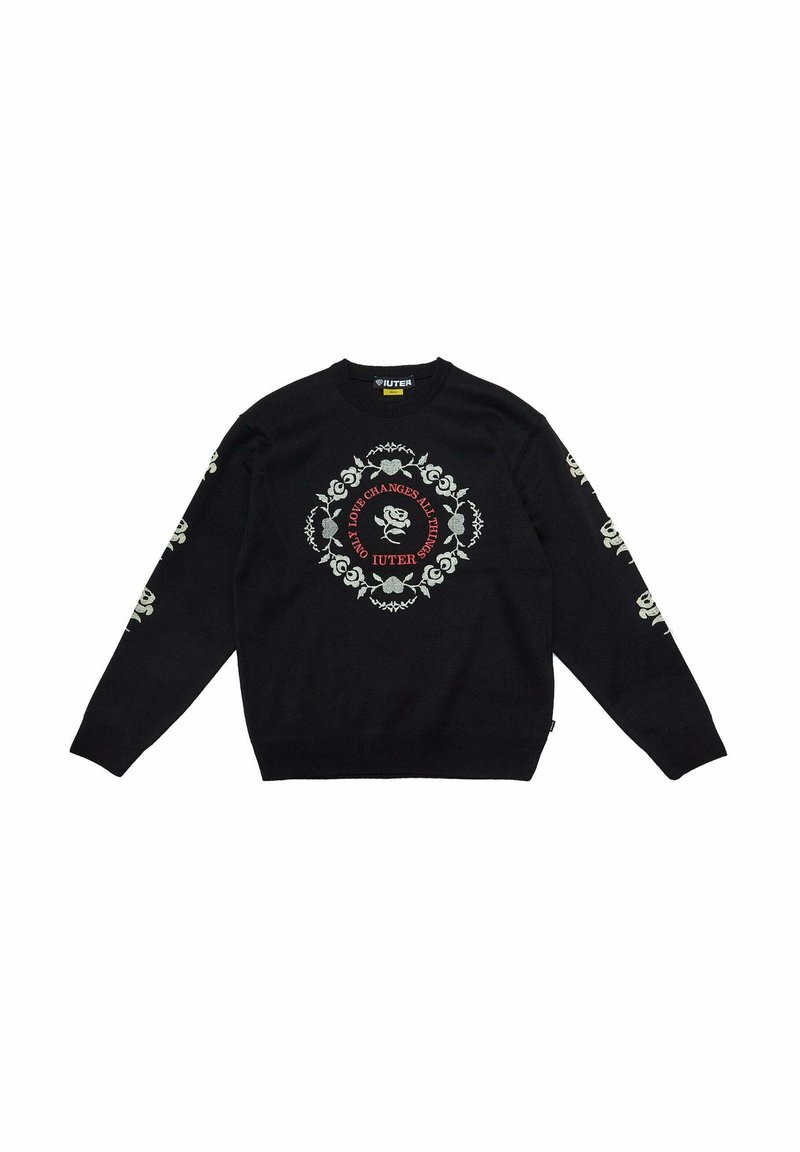Maglione nero lavorato a maglia con un motivo floreale centrale in bianco e rosso, con dettagli floreali sulle maniche e polsini a coste.