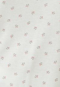 Cotton fabric with a white background, featuring a repeated pattern of small pink flowers and gray leaves, creating a delicate design.