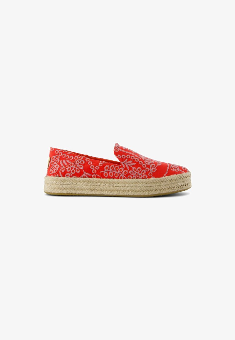 Red espadrille with a woven jute sole, featuring intricate white floral embroidery. Slip-on design, flat shape with no fastening.