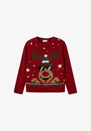 Maglione rosso lavorato a maglia con un renna che indossa occhiali da sole e un cappello verde, circondata da fiocchi di neve bianchi e la scritta "BUON NATALE".