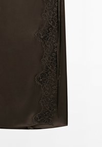 Dark brown satin fabric with a floral lace trim along the edge on a plain white background.