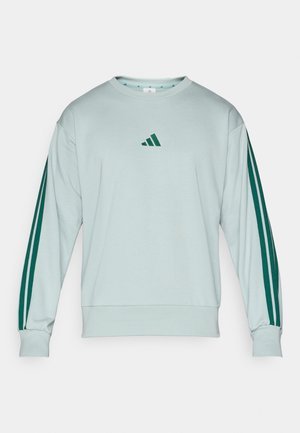 Miętowy sweter z okrągłym dekoltem, zwężanymi mankietami i ciemnozielonymi trzema paskami na rękawach, z małym logo na piersi.