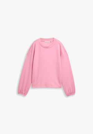 Różowa bluza z długim rękawem, okrągłym dekoltem, elastycznymi mankietami, luźnym krojem i gładkim wzorem na białym tle.