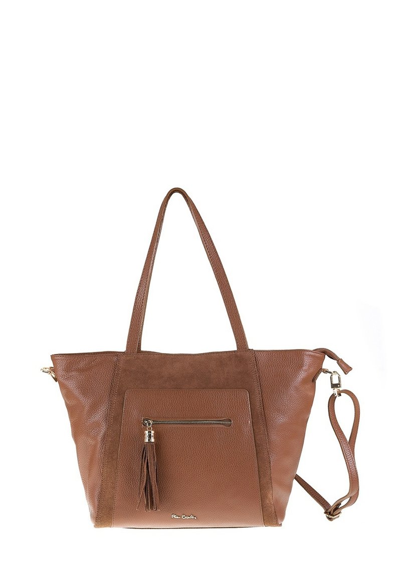 Sac en cuir marron avec poignées doubles, poche zippée avant avec gland, et bandoulière amovible sur un fond blanc.