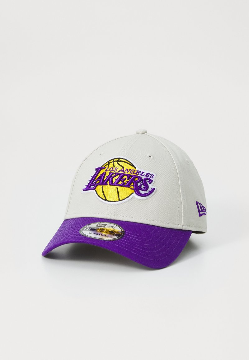 Gray cap with a purple brim, featuring an embroidered yellow basketball and “Los Angeles Lakers” logo on the front. Adjustable fit.