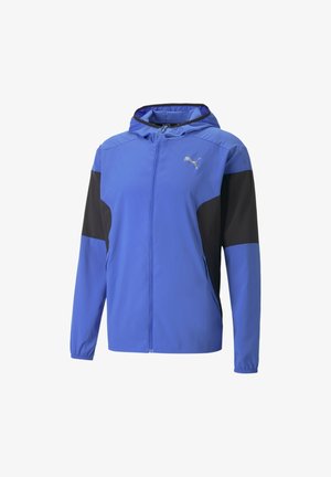 Veste à capuche bleue avec panneaux de manches noirs, fermeture éclair à l'avant, poignets élastiques et logo Puma argenté sur la poitrine.