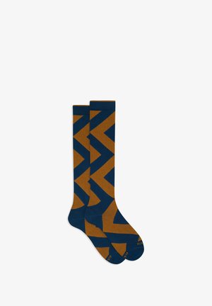 Calze al ginocchio in blu navy e marrone con un motivo a zigzag. Realizzate in un materiale morbido ed elastico per il massimo comfort. Accentuate con il logo del marchio.