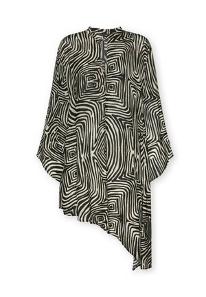 Tunique asymétrique avec motif abstrait noir et blanc rappelant un labyrinthe et manches longues larges.