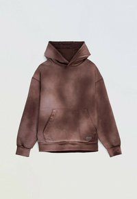 Brązowa bluza z kapturem z dużą kieszenią z przodu. Miękka, teksturowana tkanina o wyblakłym, gradientowym wyglądzie. Posiada ściągacze na mankietach i u dołu.