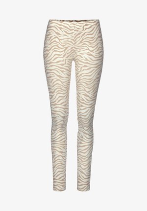 Zebra-print slim-fit pants in beige and cream, featuring a smooth texture and elastic waistband for comfort.