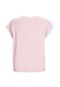 Blouse rose clair à manches courtes avec un col rond et une couture verticale au centre du dos.