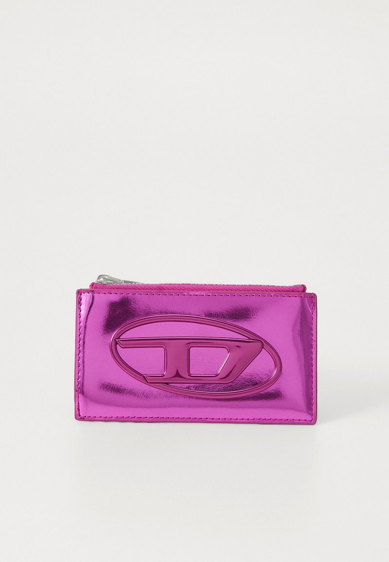 Rectangular zip wallet in glossy, metallic fuchsia with a prominent embossed logo on the front and contrasting stitching. Smooth texture.