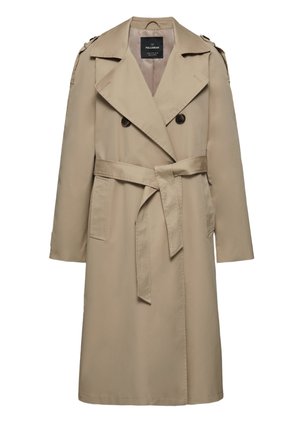 Person wearing beige double-breasted trench coat with black buttons tied at waist, layered over blue striped shirt and gray t-shirt.