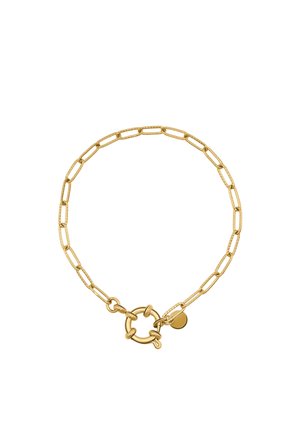 Gold chain bracelet with elongated links and a round toggle clasp, featuring a small circular charm near the clasp.