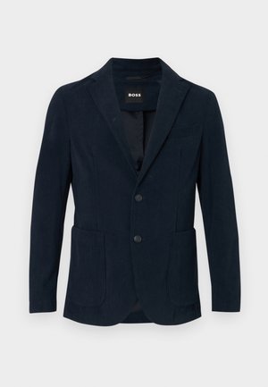 Navy modri korduroj blazer z zareznim ovratnikom, dvema sprednjima žepoma, zapenjanjem na dva gumba in enim žepom na prsih.