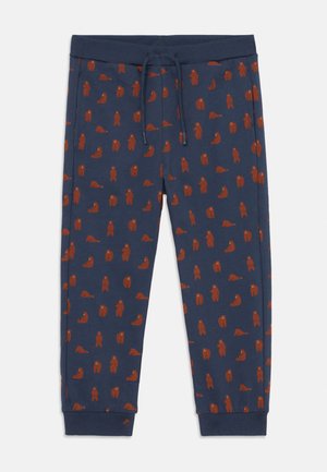 Navy joggers featuring a pattern of brown bears, made of soft fabric with an elastic waistband and cuffs, and a drawstring for adjustable fit.