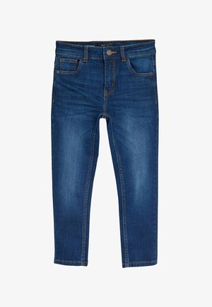 Niebieskie obcisłe dżinsy typu skinny z pięcioma kieszeniami, zapięciem na guziki z przodu oraz zamkiem błyskawicznym, ułożone płasko na białym tle.