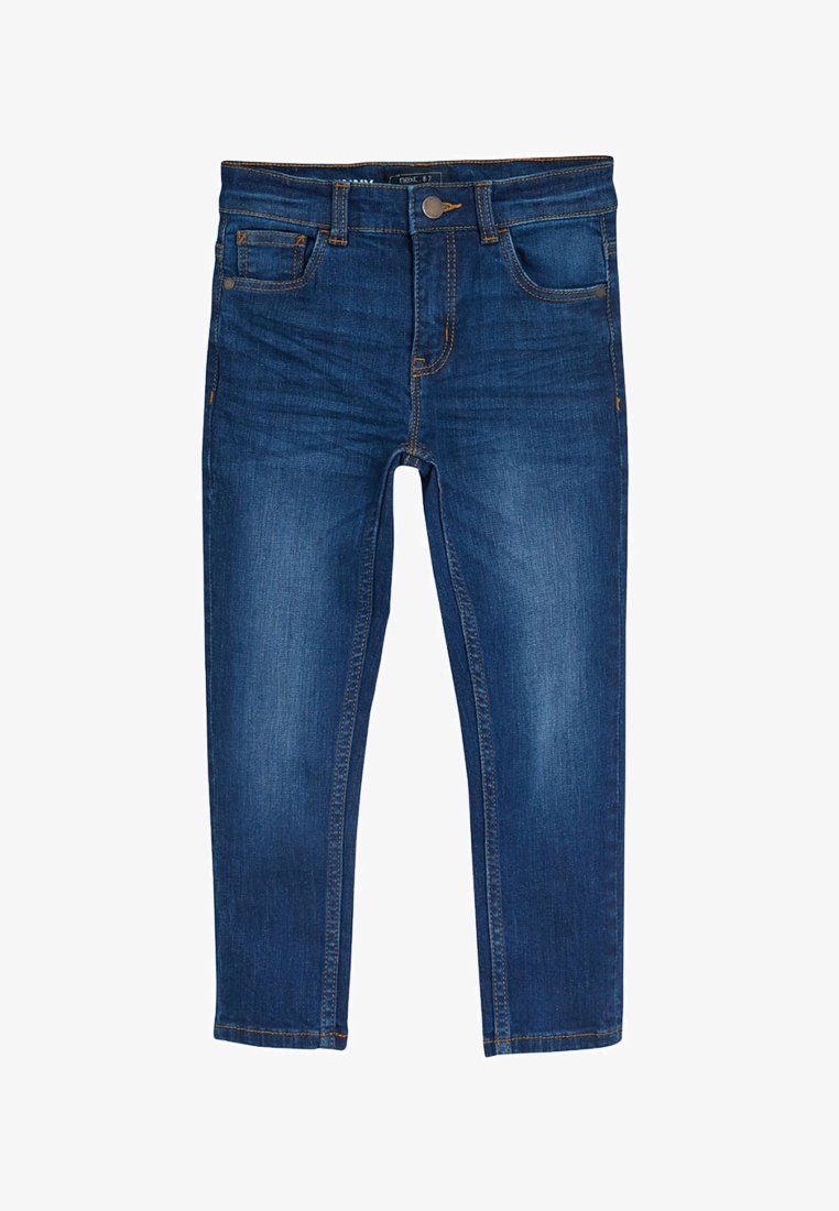 Modré džínsové skinny rifle s piatimi vreckami, predným zapínaním na gombík a zips, položené na bielom pozadí.