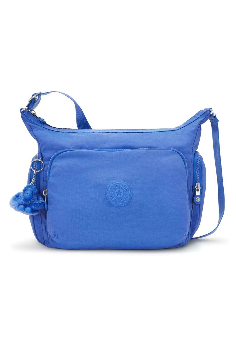 Borsa a spalla blu realizzata in morbido tessuto, con una tasca frontale con zip, tracolla e un piccolo portachiavi a forma di scimmietta blu come dettaglio.