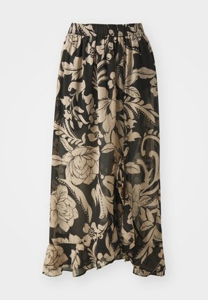 Jupe longue noire à motifs floraux, dotée d'une taille élastique, d'un tissu transparent et de grands motifs de fleurs beiges avec un design fluide au niveau de l'ourlet.