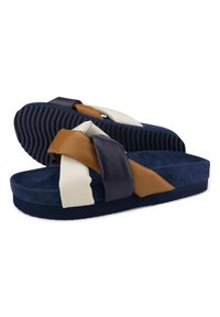 Navy blue sandals with a textured rubber sole. Features wide, interlocking straps in brown, navy, and cream leather.