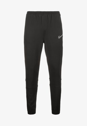 Czarne sportowe spodnie joggery z elastycznym pasem i ściągaczami, z białym logo Nike Swoosh na górnej części uda.