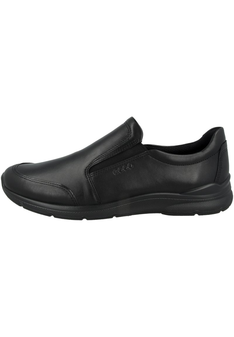 Schwarzer Slipper aus glattem Leder, mit elastischen Seitenpaneelen, runder Spitze und einer strukturierten Gummisohle für besseren Halt.