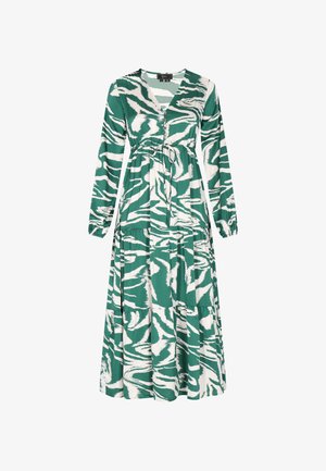 Zelena i bijela maxi haljina s dugim rukavima, zavrnutim V-izrezom i remenom za vezanje. Ima cjeloviti apstraktni uzorak tigrovih pruga i slojevitu konstrukciju.