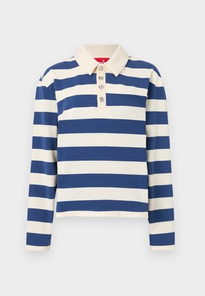 Stripete polo skjorte med brede marineblå og kremfargede striper, en kragehals og fem dekorative knapper foran. Lange ermer.