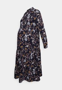 Vestido de maternidade floral em azul marinho escuro, com mangas longas, colarinho abotoadado e saia em camadas; apresenta padrões de flores multicoloridas.