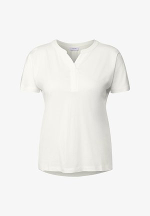 Hvid T-shirt med korte ærmer lavet af bomuld. Har en lille V-udskæring med en strop. Glat tekstur, lige snit og en afrundet kant.