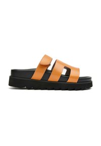 Orange leather sandals with two wide straps over a black platform sole, featuring a zigzag tread pattern for grip. Velcro closure detail.