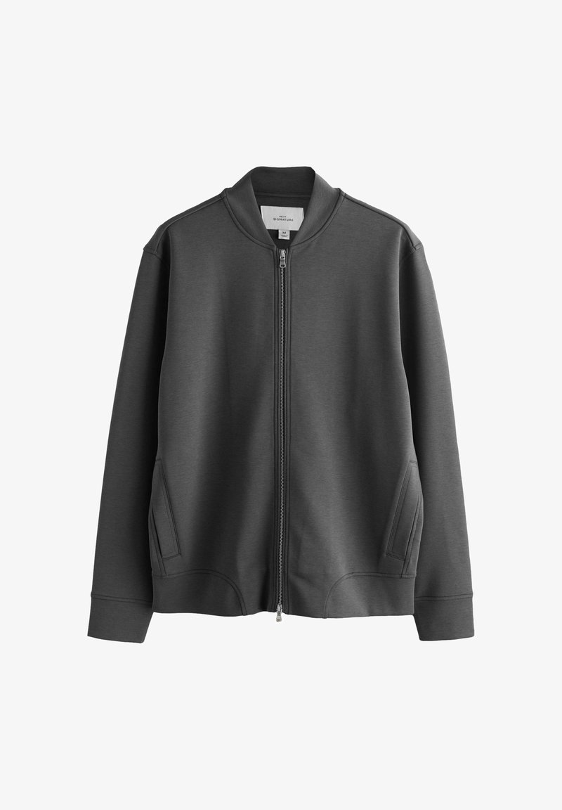 Veste zippée gris foncé avec col, manches longues et poches avant, présentée sur un fond blanc.