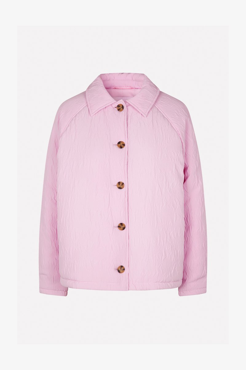 Pink quilted jacket with a collar, featuring five large brown buttons down the front and raglan sleeves for a relaxed fit.